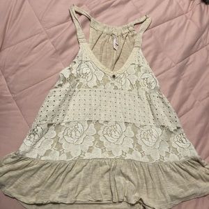 Beige sleeveless blouse with lace design